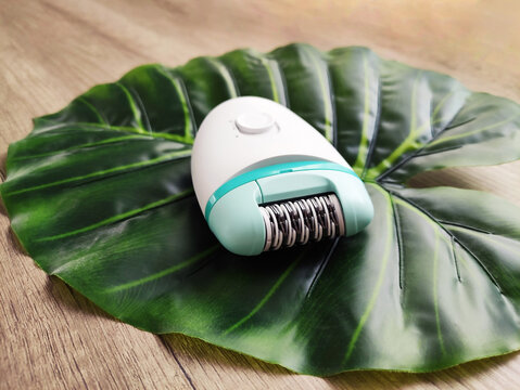 Electric epilator for hair removal and skin care. Device for female hygiene, beauty, depilation and everyday home grooming routine.