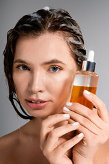 Charming portrait of a young woman revealing luminous hair care secrets © LIGHTFIELD STUDIOS