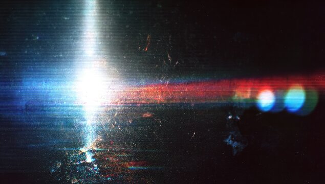Bright lens flare with chromatic aberration and light streaks on a dark textured background