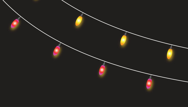 Colorful string lights glowing in darkness