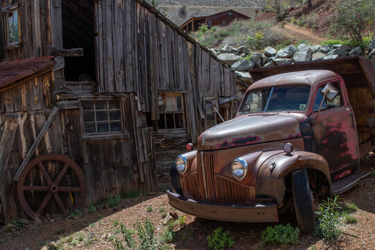 Ghost Town in Jeremy, Arizona with old cars, trucks and mining equipment and old buildings