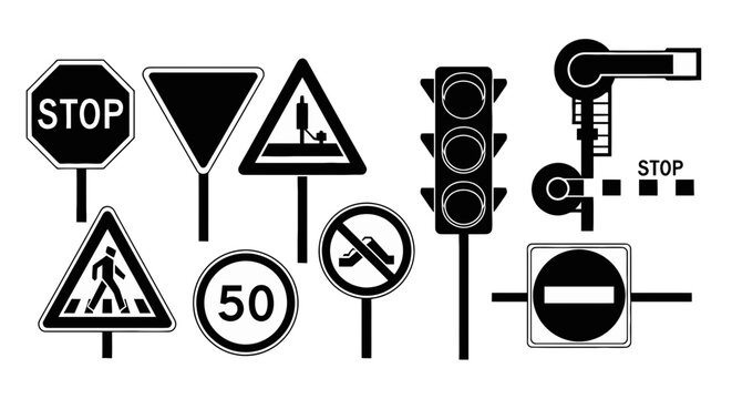 A collection of various traffic signs displayed on poles and a traffic light.