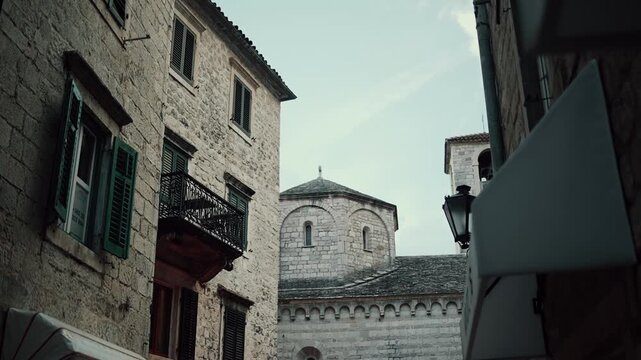 Cinematic ground-level footage of Kotor featuring narrow stone streets, medieval architecture, cozy atmosphere, and Adriatic coastal charm.