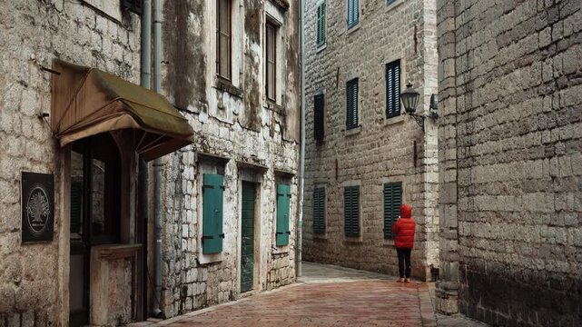 Cinematic ground-level footage of Kotor featuring narrow stone streets, medieval architecture, cozy atmosphere, and Adriatic coastal charm.