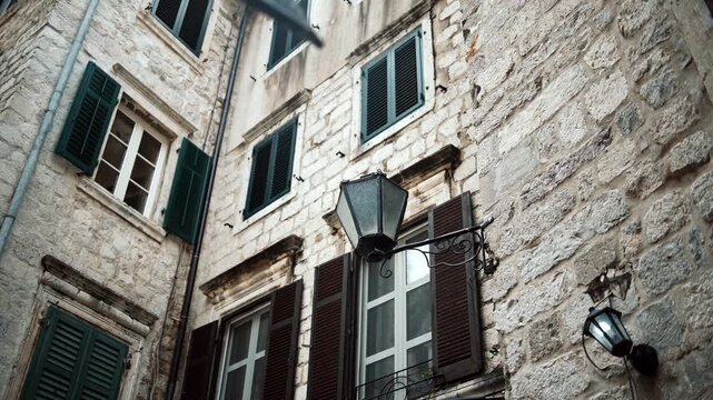 Cinematic ground-level footage of Kotor featuring narrow stone streets, medieval architecture, cozy atmosphere, and Adriatic coastal charm.