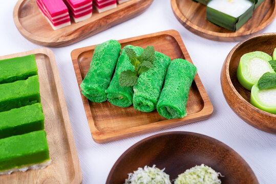 Kuih Dadar Or Ketayap - Rolled Crepe Filled with Grated Coconut and Palm Sugar and other Malaysian dessert