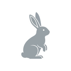 Obraz premium Gray rabbit sitting on ground.