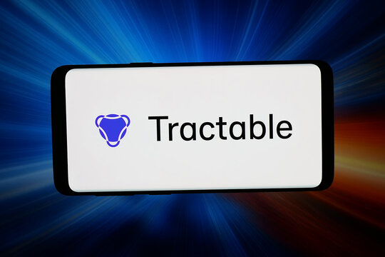 Stuttgart, Germany - 04-28-2026: In this photo illustration, the logo of artificial intelligence company Tractable AI is displayed on a smartphone in front of abstract background on computer screen.