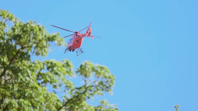 orange rescue helicopter air ambulance, German Special emergency medical service aviation, air ambulance, conducting emergency operations and medical evacuation, challenging rescue tasks and disasters