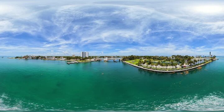 Aerial 360 VR video flying over the Hillsboro Inlet bridge with view of lighthouse 8k 2026