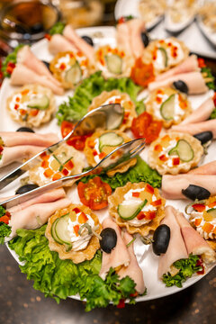 Assorted appetizers and canap&eacute;s on a party platter for catering and buffet gatherings