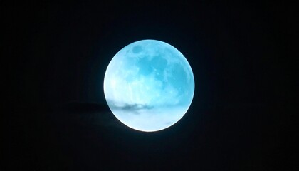 Obraz premium Blue moon glowing in night sky
