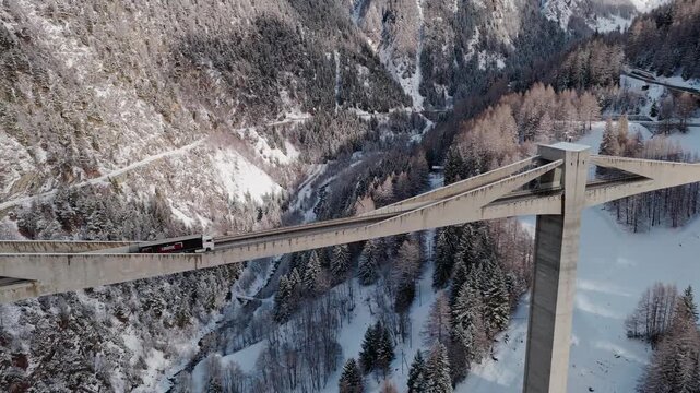 Areal view of Simplon bridge in the winter mountain valley