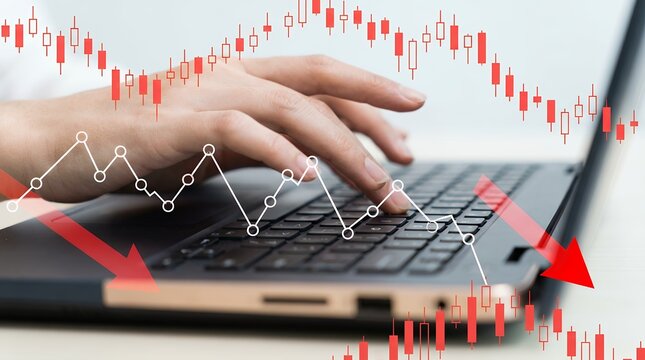 A person's hands typing on a laptop keyboard with a red financial candlestick chart showing a downward trend and red arrows indicating a decline 169 characters stock market