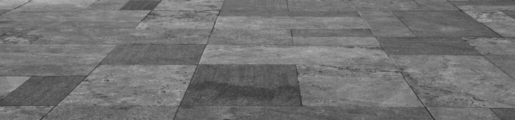 Fototapeta premium empty stone floor top in perspective. grey tile floor background in perspective view. line. empty copy space stone street. pavement. Granite outdoor tiled floor. gray granite. Marble texture
