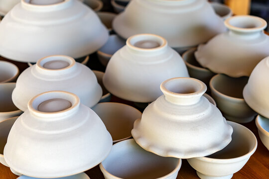 clay handicrafts in various shapes such as vases, glasses and bowls. Crafts from clay. Creativity.
