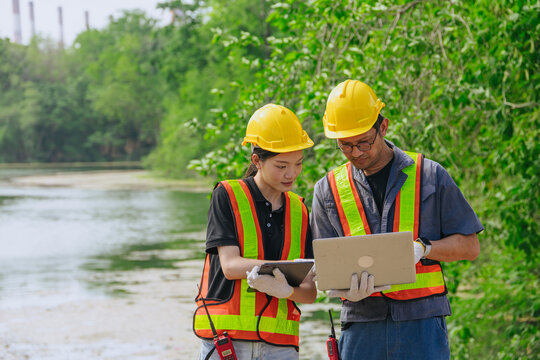 Environment engineer team working survey, inspector industry impact of water river green forest