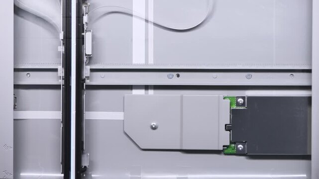 Close up of flatbed scanner carriage and internal mechanism with gray tones and vertical alignment