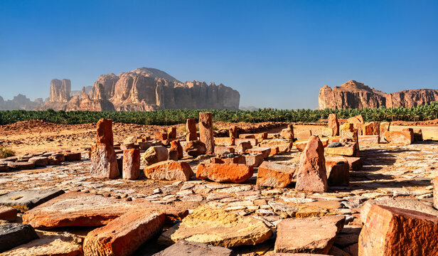 View of the archaeological site of the ancient City of Dadan featuring stone ruins and sandstone mountains in AlUla, Saudi Arabia