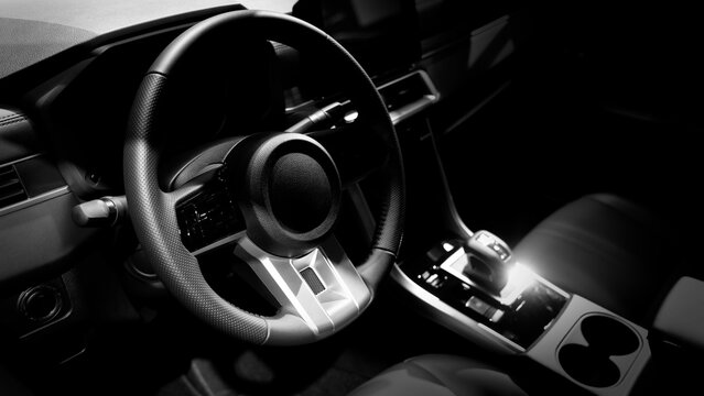 EV Car steering wheel. Modern car interior with luxury steering wheel dashboard and digital monitor controls. Steering wheel and automotive cabin. Car technology comfort and premium design in EV car.