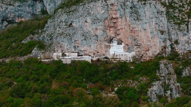 Cinematic footage of the famous Ostrog Monastery in Montenegro. Built into a dramatic cliffside, this iconic Orthodox monastery is one of the most important pilgrimage sites in the Balkans.