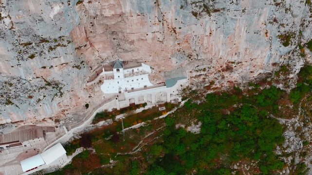 Cinematic footage of the famous Ostrog Monastery in Montenegro. Built into a dramatic cliffside, this iconic Orthodox monastery is one of the most important pilgrimage sites in the Balkans.
