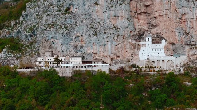 Cinematic footage of the famous Ostrog Monastery in Montenegro. Built into a dramatic cliffside, this iconic Orthodox monastery is one of the most important pilgrimage sites in the Balkans.