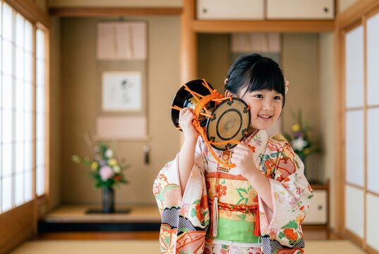 Proud Japanese Girl in Formal Kimono Playing Traditional Tsuzumi Hand Drum, Cultural Performance 