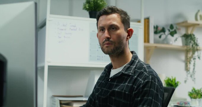 Caucasian man freelancing, typing code on laptop, building secure web apps, database queries, cloud connectivity and cyber protections.
