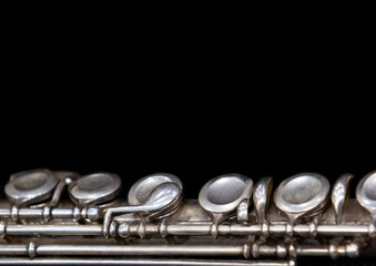 Obraz premium A fragment of a flute on a black background