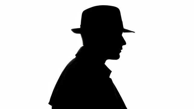 A shadowed silhouette of a person in a bowler hat against a white background. It shows profile