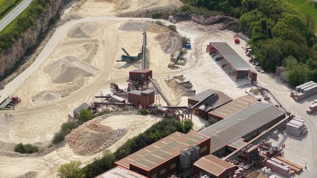 Aerial view of Marshalls industrial quarry and manufacturing site with conveyor belts and machinery in Maltby, England, United Kingdom.