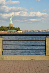 Fototapeta premium Liberty Statue Scene. Scenic Depiction Of Monument Near Harbor And Skyline new york