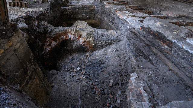 Exposed part of a vaulted cellar under the floor during excavations.