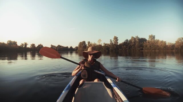 Traveler Paddling In Kayak On Calm River. Outdoor Adventure. Rowing And Weekend Relaxation