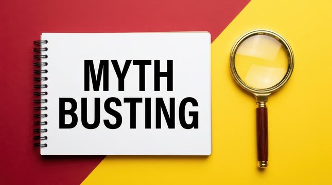 Myth busting text on white notebook with magnifying glass on red and yellow background