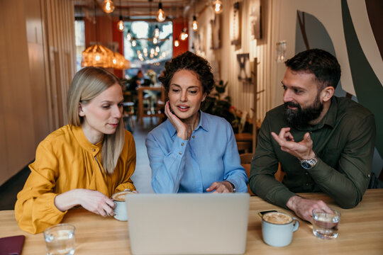 Business people having a casual meeting in a cafe