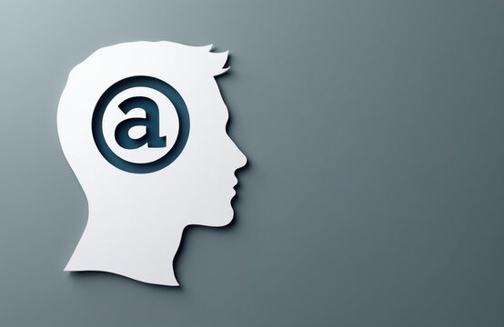 White paper head silhouette cutout with atheism symbol inside. Empty grey background shows a person thought or idea. Copy space for custom text.