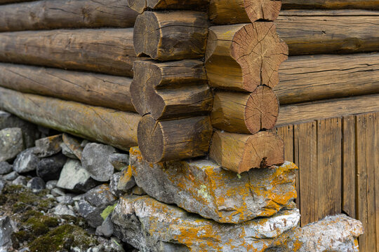 Detailes of an old log house stands on stone piles. Traditional Scandinavian and Norwegian architecture.