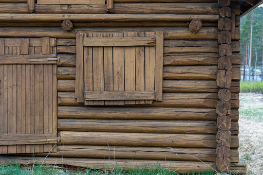 Detailes of an old log house stands on stone piles. Traditional Scandinavian and Norwegian architecture.
