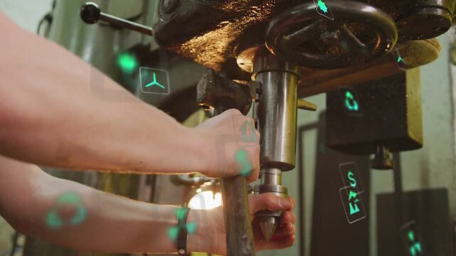 Man gripping lever, aligning drill bit, securing tool for machining as green AR icons float