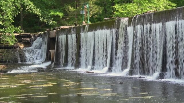 Built in 1962, this concrete dam is a mere 10 feet high but 190 feet long, playing a significant role in the water management of the region. 