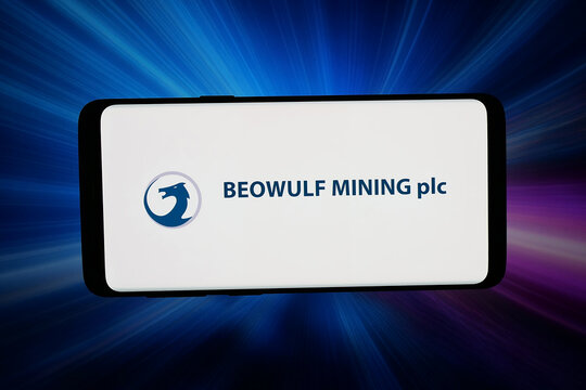 Stuttgart, Germany - 04-28-2026: In this photo illustration, the logo of British company Beowulf Mining plc is displayed on a smartphone in front of abstract background on computer screen.