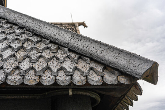 Pagan dragon heads and Christian crosses on the roof of the stave church in Norway. Authentic traditional Norwegian stabbur (raised wooden storehouse) in the rural landscape of Rjukan, Telemark.