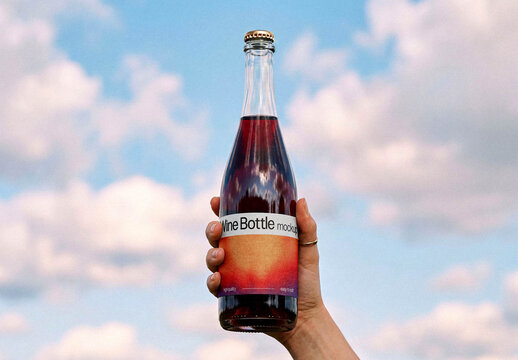 Beverage Bottle Mockup &ndash; in Hand Packaging Branding Presentation (PSD)