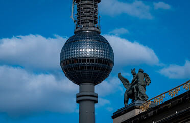 Rooftop sculpture with Pegasus and figure at the Altes Museum in Berlin with Fernsehturm in background © Jrg