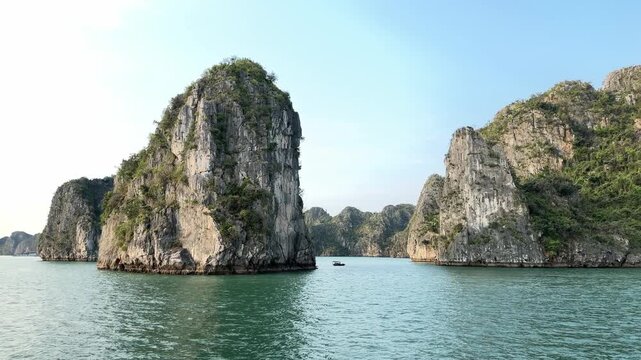 Panoramic view of limestone karst islands in Halong Bay Vietnam with turquoise water and dramatic rock formations for travel tourism themes
