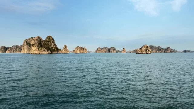 Scenic View of Halong Bay with Tranquil Blue Waters and Majestic Limestone Islands
