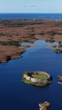 Aerial of the historic Ringfort at Lough Doon, Portnoo, County Donegal, Ireland