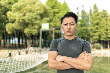 Fototapeta premium Confident Young Man Standing in Outdoor Park